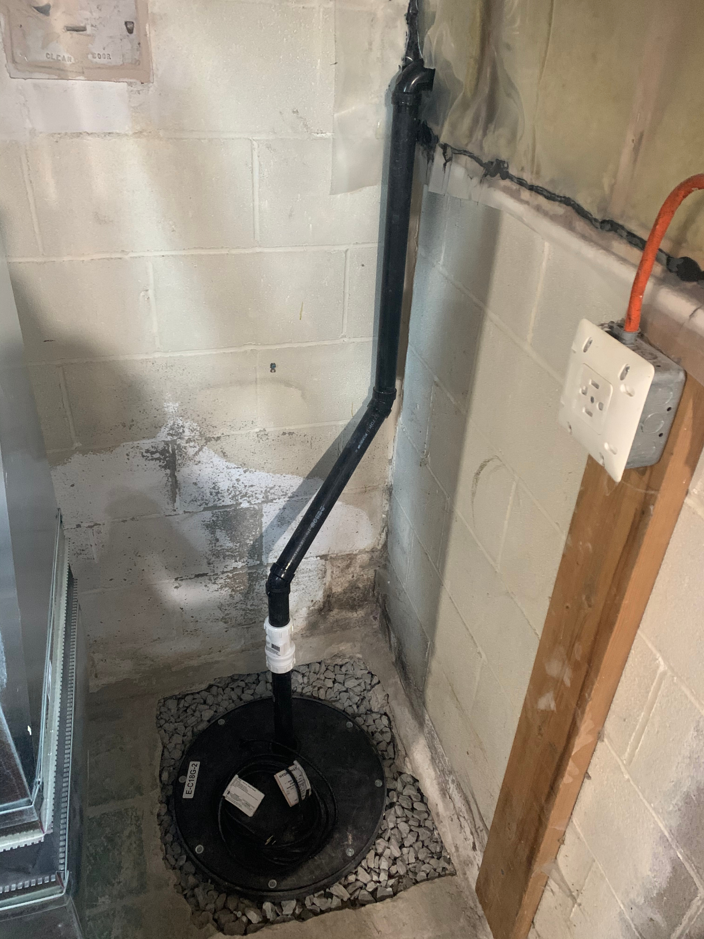 SafeStep sump pump installation with discharge line in basement